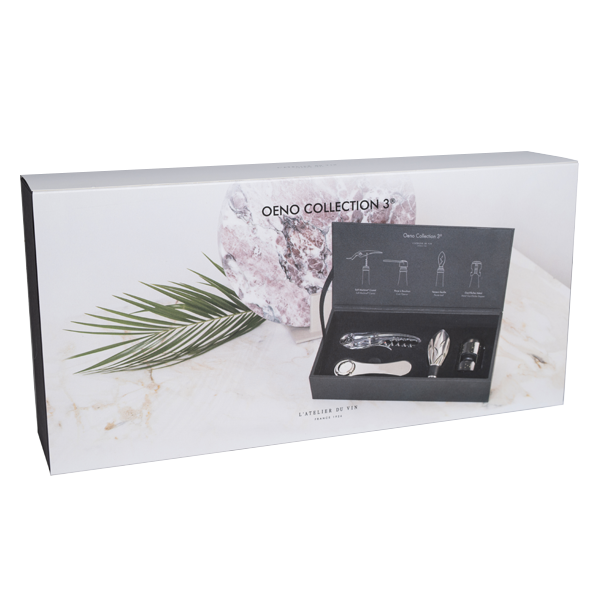 Caja de packaging L'Atelier du Vin Oeno Collection 3 con cofre negro sobre superficie de mármol