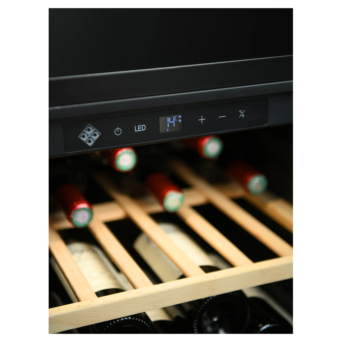 Detail of the digital control panel of the La Sommelière SMART112 wine cooler above bottles on wooden shelves