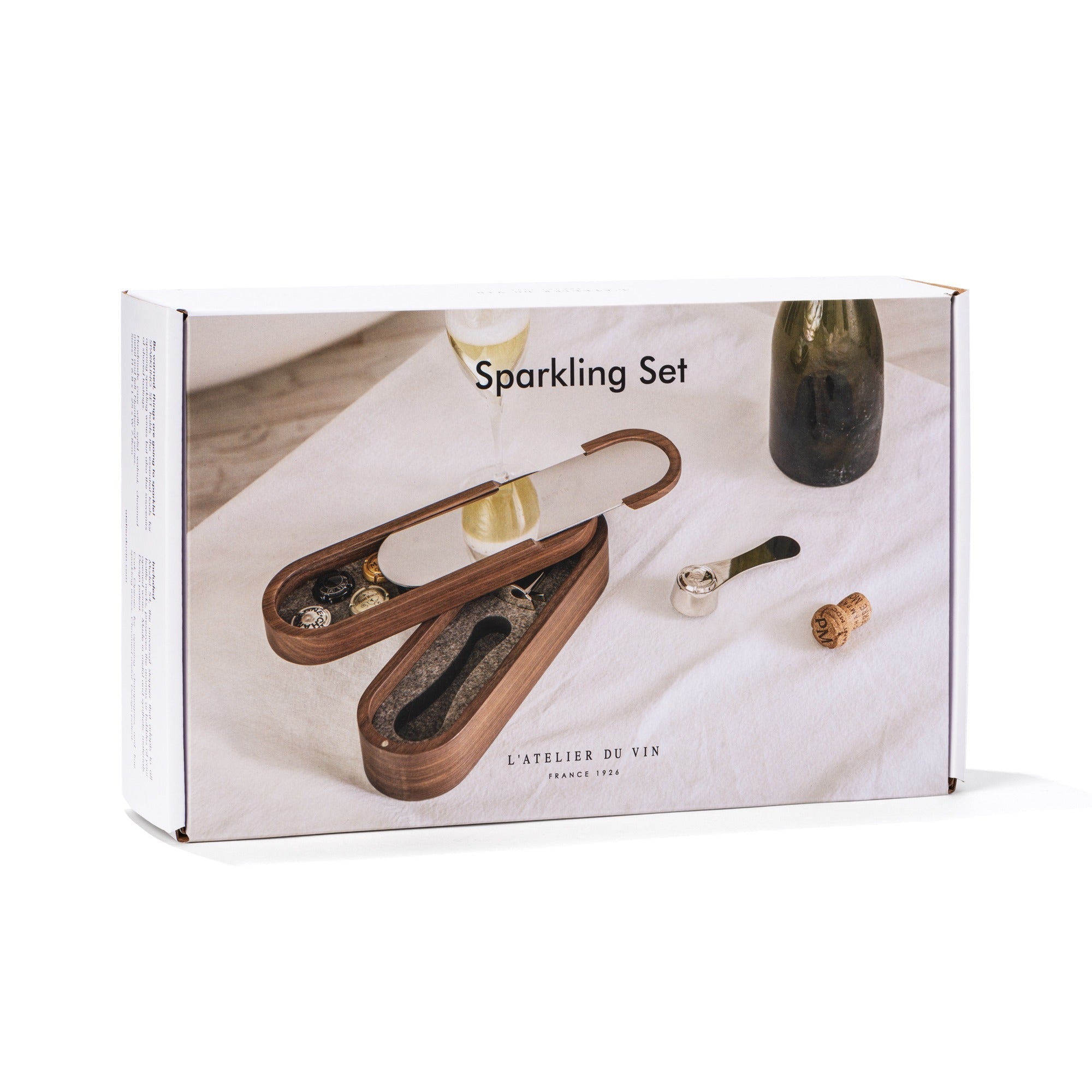 Caja de regalo del Sparkling Set de L'Atelier du Vin con ilustración del estuche de nogal abierto y botella