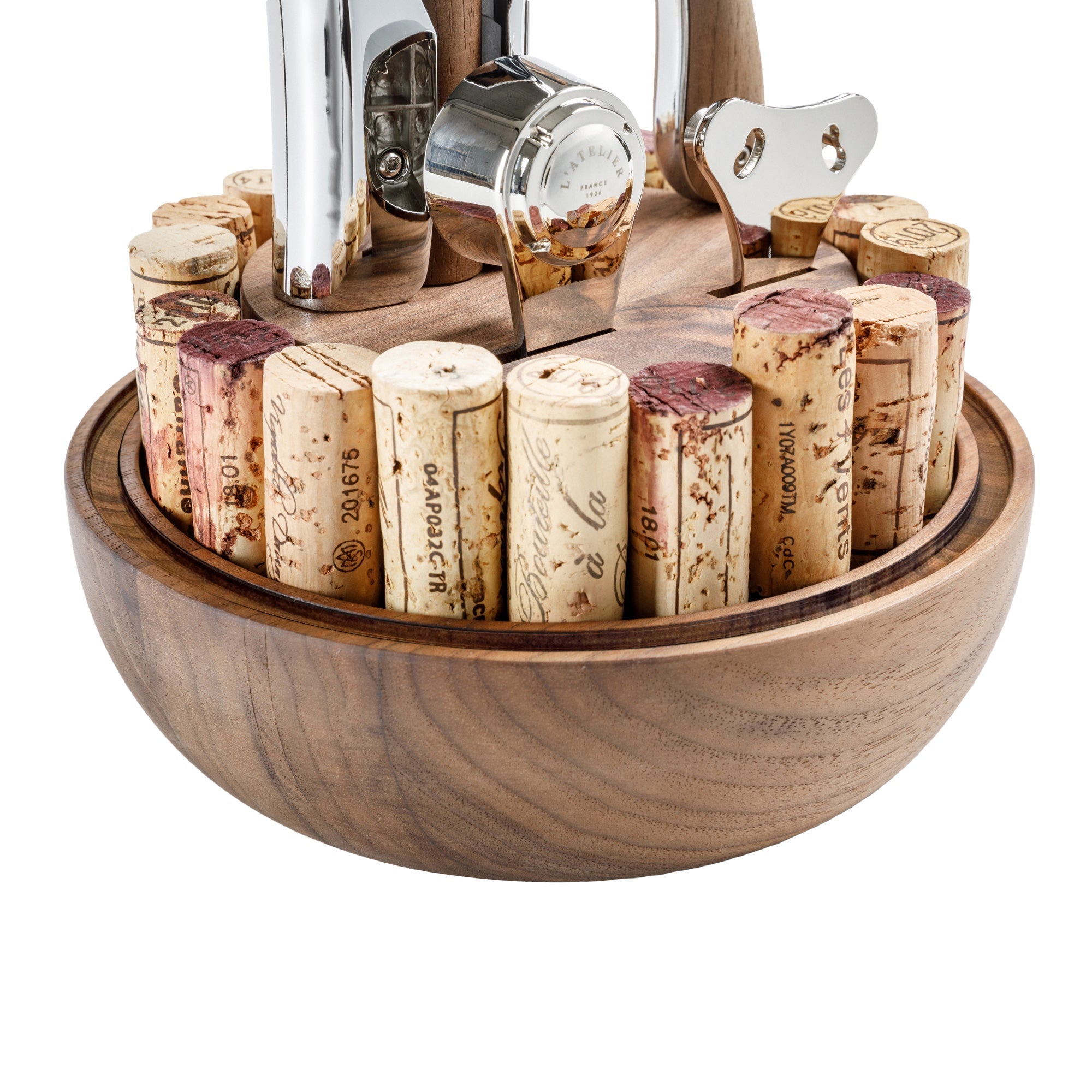Detalle de base de madera con corchos y accesorios del descorchador L'Atelier du Vin Oeno Motion Groom